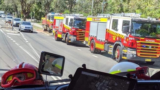 Rural Fire Service and NSW Fire &amp; Rescue vehicles attend a triple zero call at Warriewood during Tuesday’s terrible fire weather conditions. Picture: Ingleside RFS