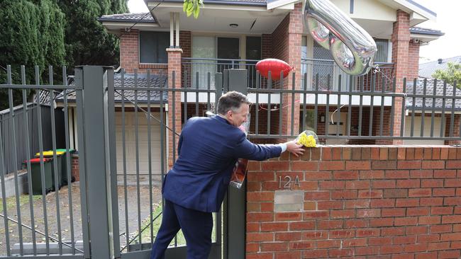 Flowers and balloons were left outside the Premier’s home on Friday arfternoon.. Picture: Richard Dobson