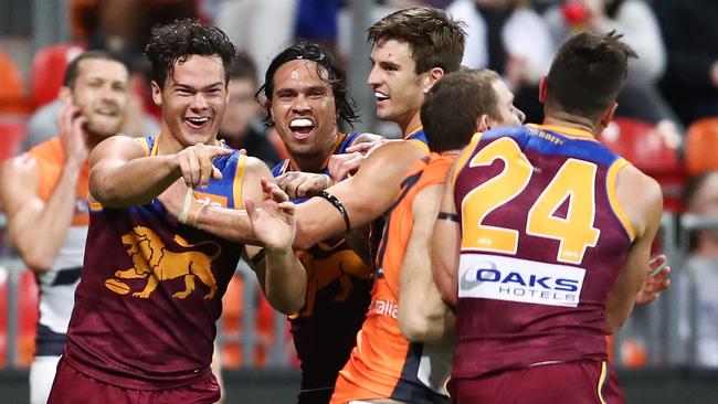 Rayner celebrates with teammates after kicking a vital goal in last week’s boilover at GIANTS Stadium. Picture: AAP Image/Brendon Thorne