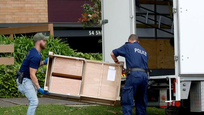 Police removed furniture from the apartment complex. Picture: Toby Zerna