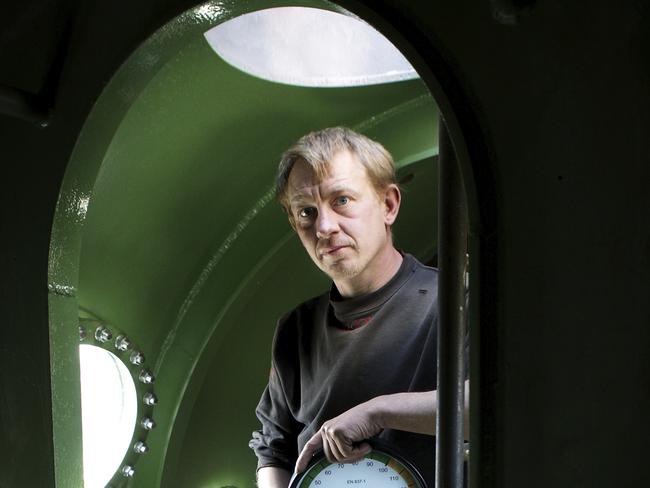 FILE -  In this April 30, 2008 file photo, submarine owner Peter Madsen stands inside the vessel. Danish police confirmed Wednesday Aug. 24, 2017, a headless torso found on a beach off Copenhagen has been identified as that of missing Swedish journalist Kim Wall. She is believed to have died on an amateur-built submarine earlier this month. Madsen has been arrested on suspicion of killing her. (Niels Hougaard /Ritzau via AP, File)