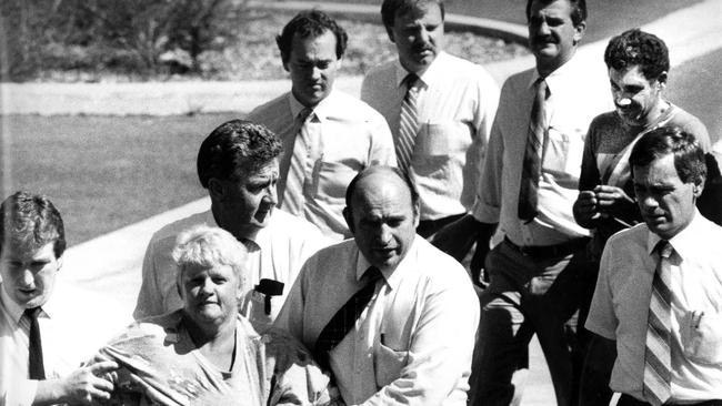 Valmae Faye Beck is escorted by police detectives to trial for the rape and murder of Sian Kingi, 12, on November 27, 1987, at Noosa. Barrie John Watts was also charged as the main offender.