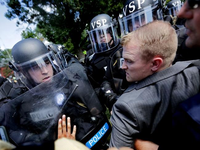 Police move in to stop the violence as groups clash in Charlottesville. Picture: Getty