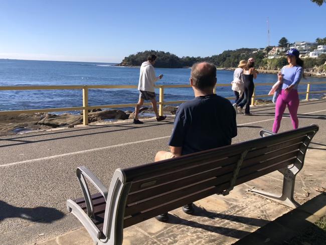 A seat, with a memorial plaque attached, looking towards Shelly Beach at Manly. Picture: Jim O’Rourke