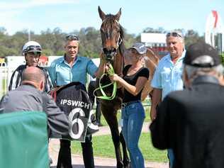 PLACE TO BE: Jockey Michael Cahill joins with connections after winning aboard Temujin's Moon at Ipswich racetrack. Picture: Rob Williams