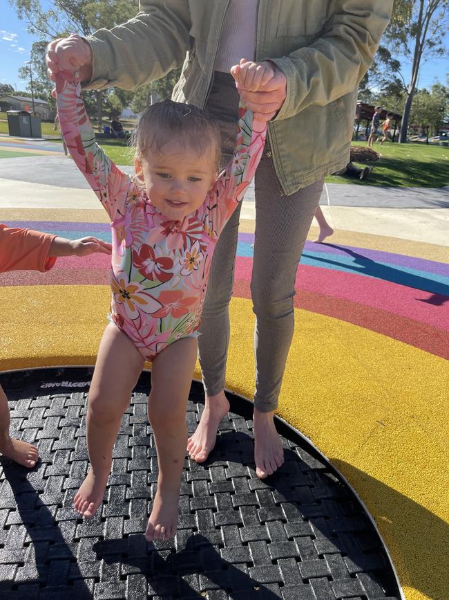 Bridie Flower, 2, having a ball at SplashSide.