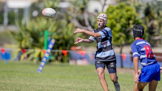 Day One of King of the Country rugby tournament at James Overell Park, Southport. Maroochydore Swans U14s' ( big stripes - blue) in action against USQ Saints U14s' (darker blue small stripes). . Picture: Jerad Williams