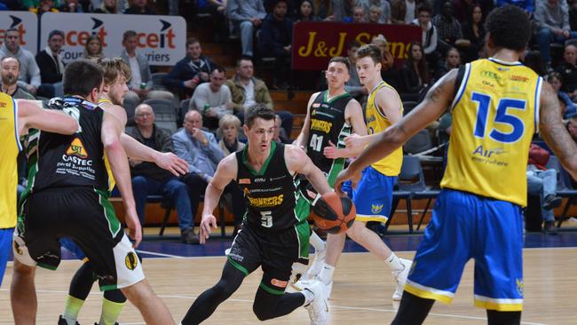 Mount Gambier captain Tom Daly attempts to drive the ball forward during the men’s Premier League basketball grand final against Forestville. Picture: AAP/Brenton Edwards