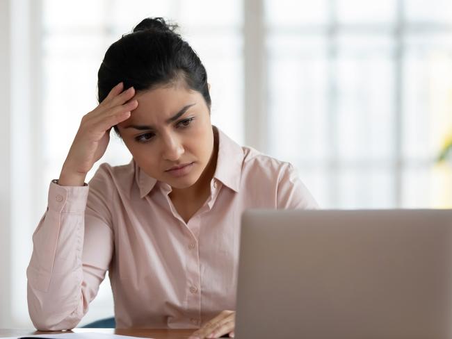 Unhappy young woman frustrated with virus or scam, investment, bills generic sad