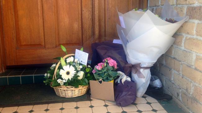 Flowers laid at the door of the Mudie family home in Wattle Grove after she was killed in the Bourke St rampage on Friday. Picture: Jeremy Piper