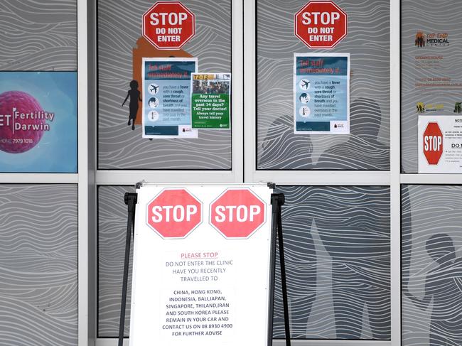 A sign out the front of Top End Medical Centre, Darwin, asking patients not to enter if they have travelled to certain countries in the past few weeks due to the coronavirus outbreak. Picture: Che Chorley