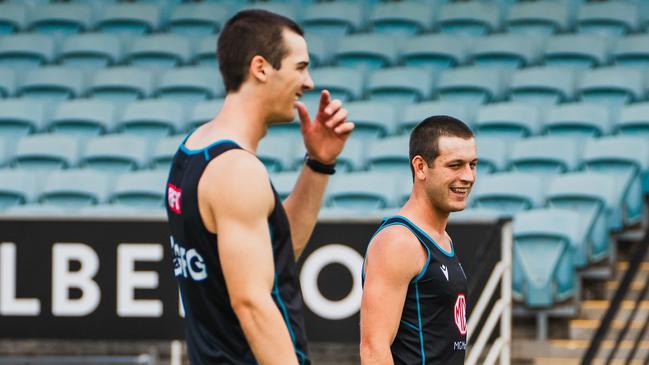 Connor Rozee and Zak Butters have returned from the Christmas break with new haircuts. Picture: PAFC