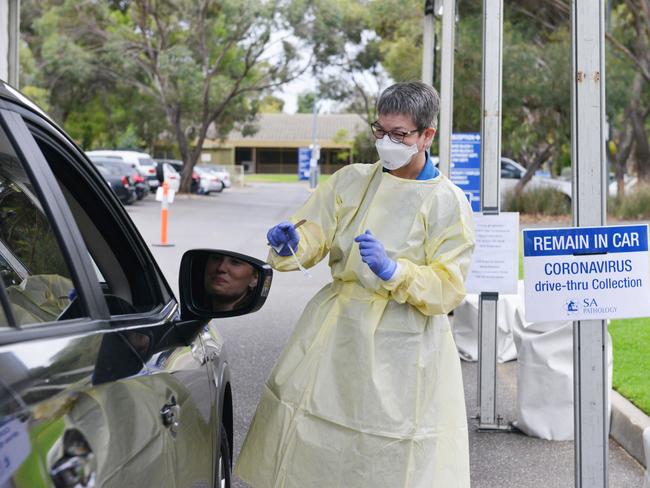 A SA Pathology nurse tests a patient at the new drive through clinic at Hampstead Rehabilition Clinic, March 24, 2020. (Photo: AAP/Brenton Edwards)