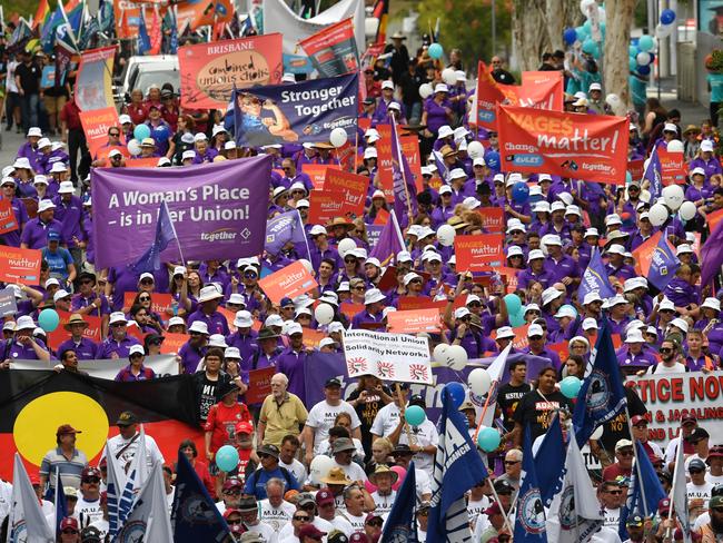 Members of Queensland Unions are seen during the annual Labour Day march in Brisbane, Monday, May 7, 2018. The Australian Council of Trade Unions (ACTU) has called on the federal government to change the industrial relations laws to provide more protections for people in casual and insecure jobs. (AAP Image/Darren England) NO ARCHIVING