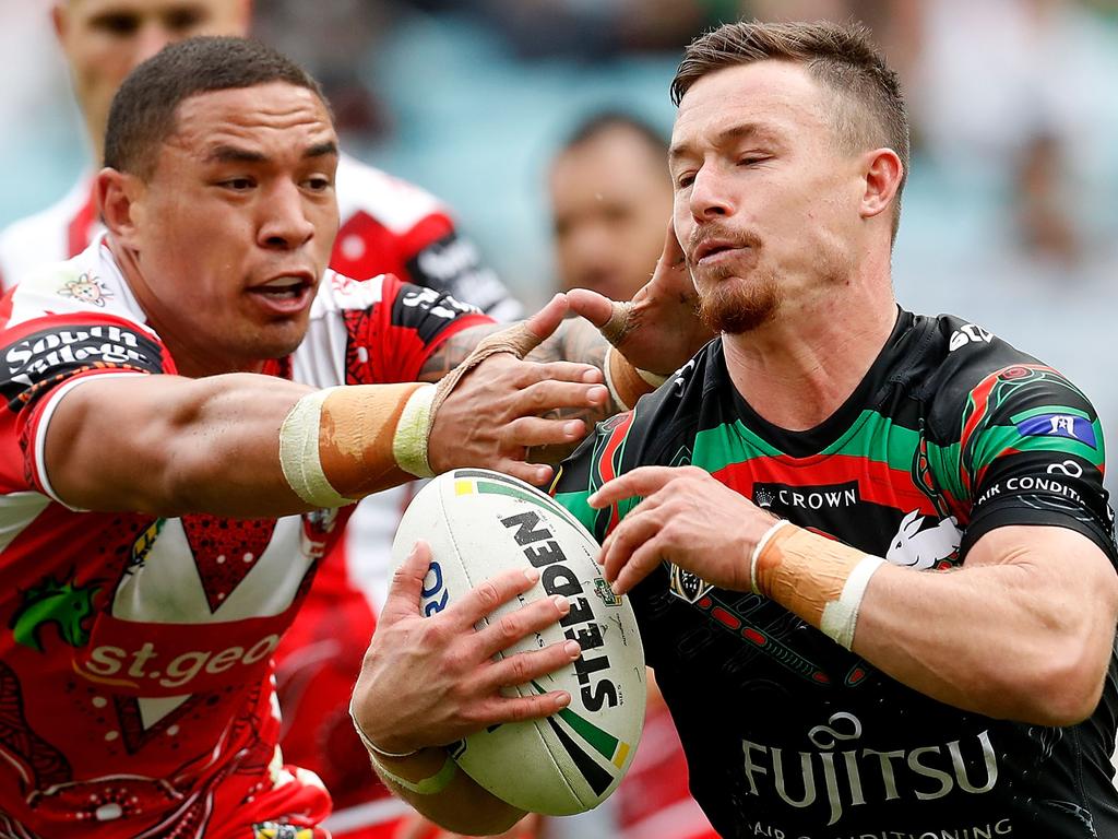 SYDNEY, AUSTRALIA - MAY 13:  Damien Cook of the Rabbitohs is tackled during the round 10 NRL match between the South Sydney Rabbitohs and the St George Illawarra Dragons at ANZ Stadium on May 13, 2018 in Sydney, Australia.  (Photo by Jason McCawley/Getty Images)