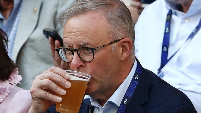 MELBOURNE . 27/01/2023.  TENNIS.  Australian Open at Melbourne Park.  Novak Djokovic vs Tommy Paul on Rod Laver Arena.  Prime Minister Anthony Albanese enjoys a frothie . Pic: Michael Klein