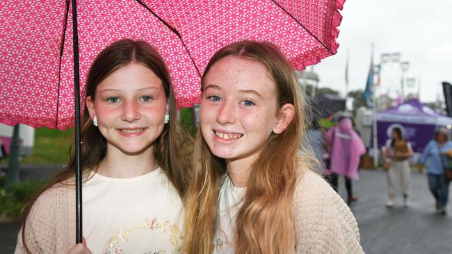 Keeping dry at the Heritage Bank Toowoomba Royal Show are Mackenzie Brushe and Ava Jefferies. Saturday March 26, 2022