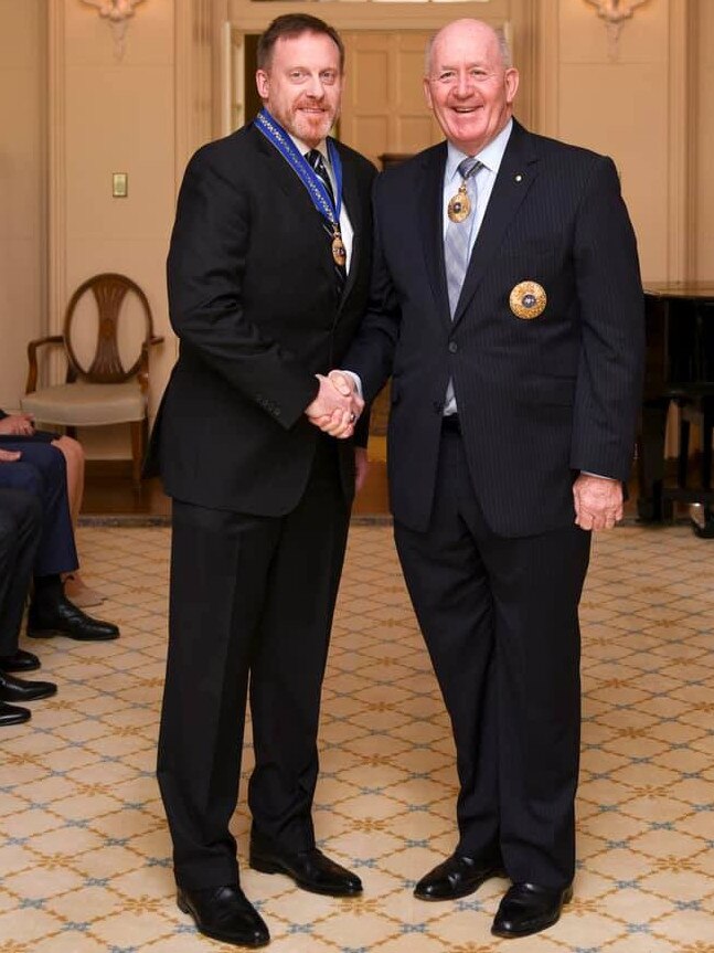 Mike Rogers receives an Honorary Officer of the Order of Australia (Military Division) from then governor-general Peter Cosgrove at Government House in Canberra in May last year.