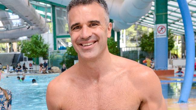 FEBRUARY 12, 2022: Peter Malinauskas with his daughter Eliza at the Adelaide Aquatic Centre in North Adelaide where he announced plans to redevelop the site if Labor wins the March election. Picture: Brenton Edwards