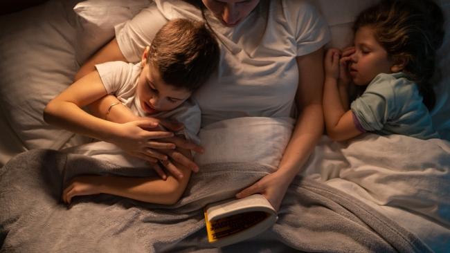 Some parents enjoy some quiet time to help their children drift off to sleep. Image: iStock