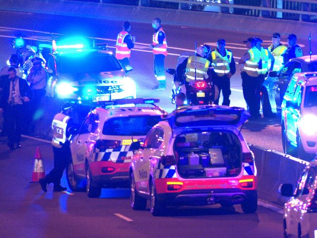 FEES APPLY, ONE TIME USE ONLY. MUST CREDIT.  Two dead after four vehicle crash on Anzac Bridge in Pyrmont, NSW ., The incident began with a minor crash shortly before 11.50pm (Friday 2 December 2022), in the citybound lanes of the Bridge, near the Pyrmont exit, involving a Toyota Camry sedan and a Holden Captiva station wagon., , Police believe the drivers of those vehicles were standing on the roadway when they have been allegedly struck by a Holden Commodore sedan., , A Toyota Camry taxi also became involved. Both the woman driving the Camry and the man driving the Captiva died at the scene. They are yet to be formally identified., , A man driving the taxi has been taken to Sydney Eye Hospital for mandatory testing, while a man driving the Commodore has been taken to Royal Prince Alfred Hospital to be treated for injuries sustained in the crash, and mandatory testing., , Officers from Sydney City Police Area Command have established a crime scene with specialist investigations being conducted by the Crash Investigation Unit., , Investigators are keen to hear from anyone with dashcam vision of the incident, or the circumstances leading up to the crash, especially those drivers travelling westbound between 11.45pm and 11.55pm., , It’s expected the bridge could remain closed for up to eight hours, and motorists are advised to check www.livetraffic.com for updates and diversions., , Anyone with information about this incident is urged to contact Crime Stoppers: 1800 333 000 MUST CREDIT OnScene Bondi