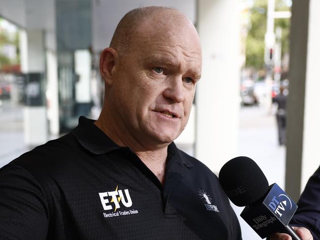 DAILY TELEGRAPH 2ND DECEMBER 2024Pictured is ETU NSW/ACT Secretary Allen Hicks outside the Fair Work Commission on William Street in Sydney.Picture: Richard Dobson