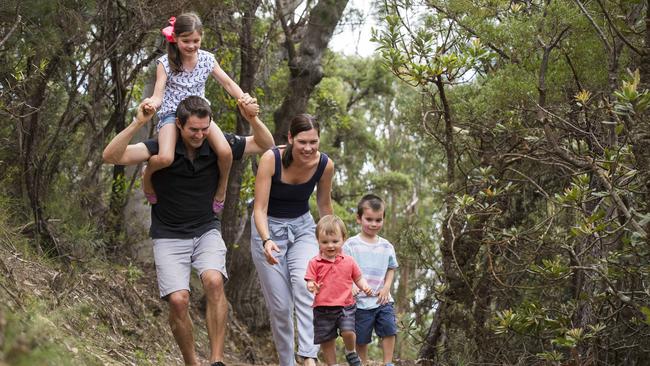 Moorebank family Ryan Zammit and Rebecca Zammit with their children Harrison, 1, Edward, 4, and Annabelle, 6, on a walking track near the Three Sisters at Katoomba. Picture: Dylan Robinson