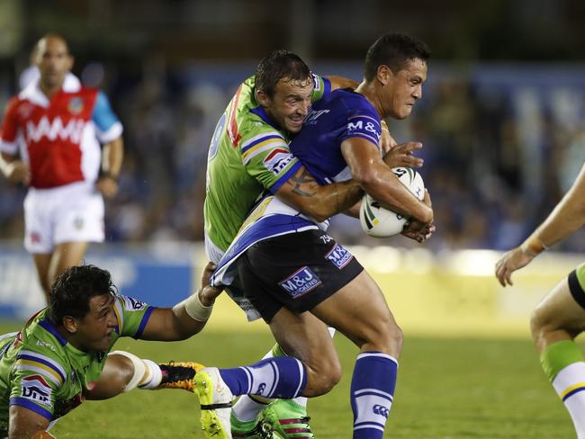 Bulldog Chase Stanley is brought down during NRL match against the Canberra Raiders at Belmore Sports Ground. Picture: Phil Hillyard