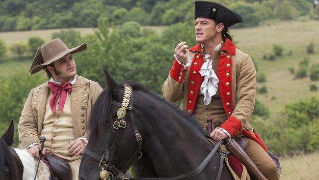 Luke Evans stars as Gaston (at right) and Josh Gad as Le Fou in Beauty and the Beast.