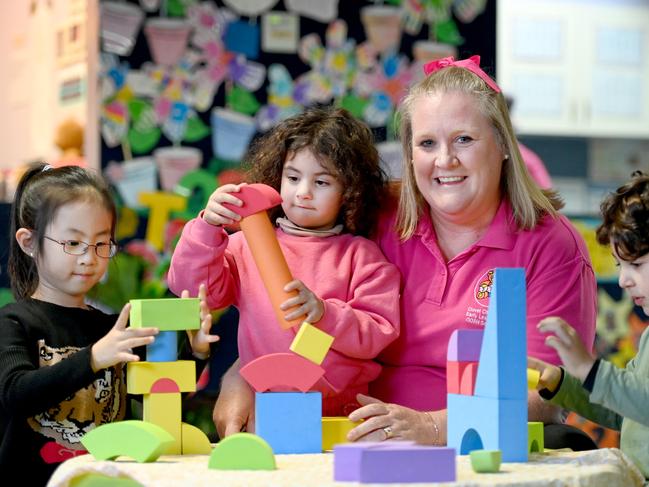 Day Care worker Theresa Willet with Lorenzo Rodriguez, Aleena El-Masri and Muse Zaeng in Merrylands. Picture: Jeremy Piper