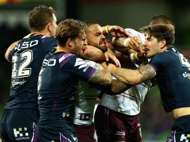 MELBOURNE, AUSTRALIA - MAY 19:  Players wrestle during the round 11 NRL match between the Melbourne Storm and the Manly Sea Eagles at AAMI Park on May 19, 2018 in Melbourne, Australia.  (Photo by Robert Prezioso/Getty Images)