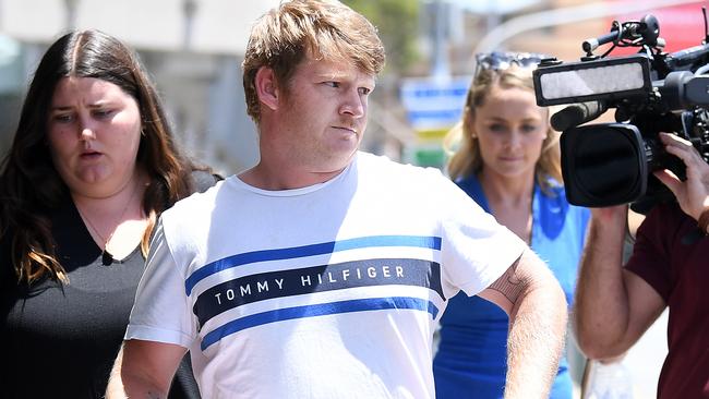 Michael Collins storms out of the Brisbane watchhouse after appearing in court charged over the assault of a man in Fortitude Valley. Picture: Dan Peled