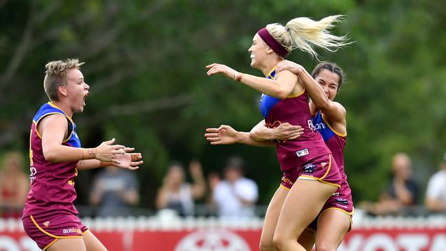 Orla O'Dwyer (centre) celebrates kicking a goal against Adelaide at Hickey Park on Saturday.