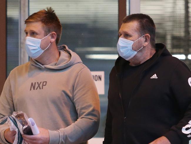 17/9/21: Darren Greenfield State Secretary and Michael Greenfield Assistant State Secretary of the CFMEU leave the Surry Hills police station on bail after being arrested on corruption charges. John Feder/The Australian.