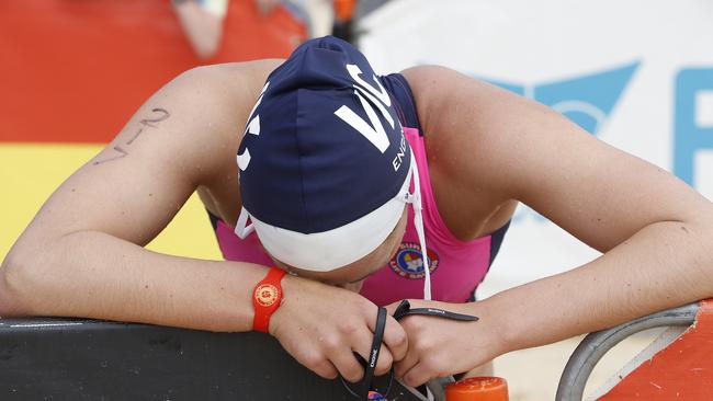 Paige Holt from Victoria catches her breath after the youth iron event.