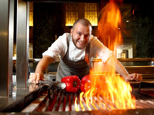 Sydney restaurants like Rockpool, Catalinas, Aria are and Icebergs are kicking off pre-apprentice courses for aspiring Aboriginal chefs in NSW. Apprentice chef Lochlan Simms pictured in the kitchen at Rockpool Bar and Grill. Picture: Toby Zerna