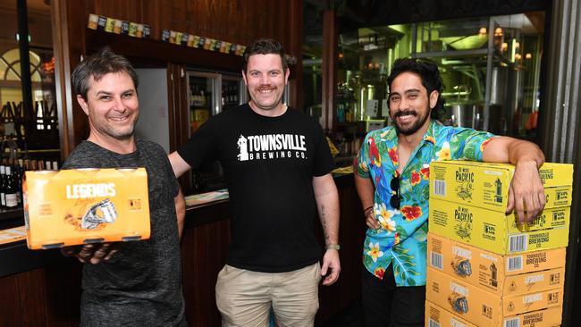 Townsville Brewing Co's competition winner of 'Townsville’s Tallest Tale' Mathew Alberdi, is presented a year's worth of beer by Townsville Brewing Co head brewer Glen Nolen and owner Tristan Bredhauer. Picture: Shae Beplate.