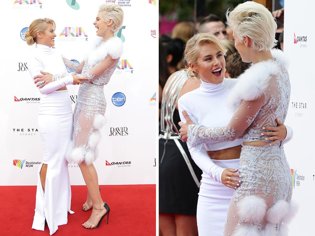 Carissa Walford and model Kate Peck greet each other on the red carpet at the ARIA Awards 2014 in Sydney, Australia. Pictures: Getty/Cameron Richardson