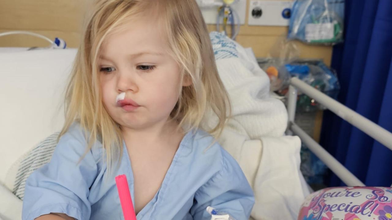 Paris colouring in and playing with her family after recovering from surgery on her lip. Picture: Supplied.