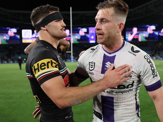 SYDNEY, AUSTRALIA - SEPTEMBER 22:  Cameron Munster of the Storm and Nathan Cleary of the Panthers embrace following the NRL Preliminary Final match between the Penrith Panthers and Melbourne Storm at Accor Stadium on September 22, 2023 in Sydney, Australia. (Photo by Matt King/Getty Images)