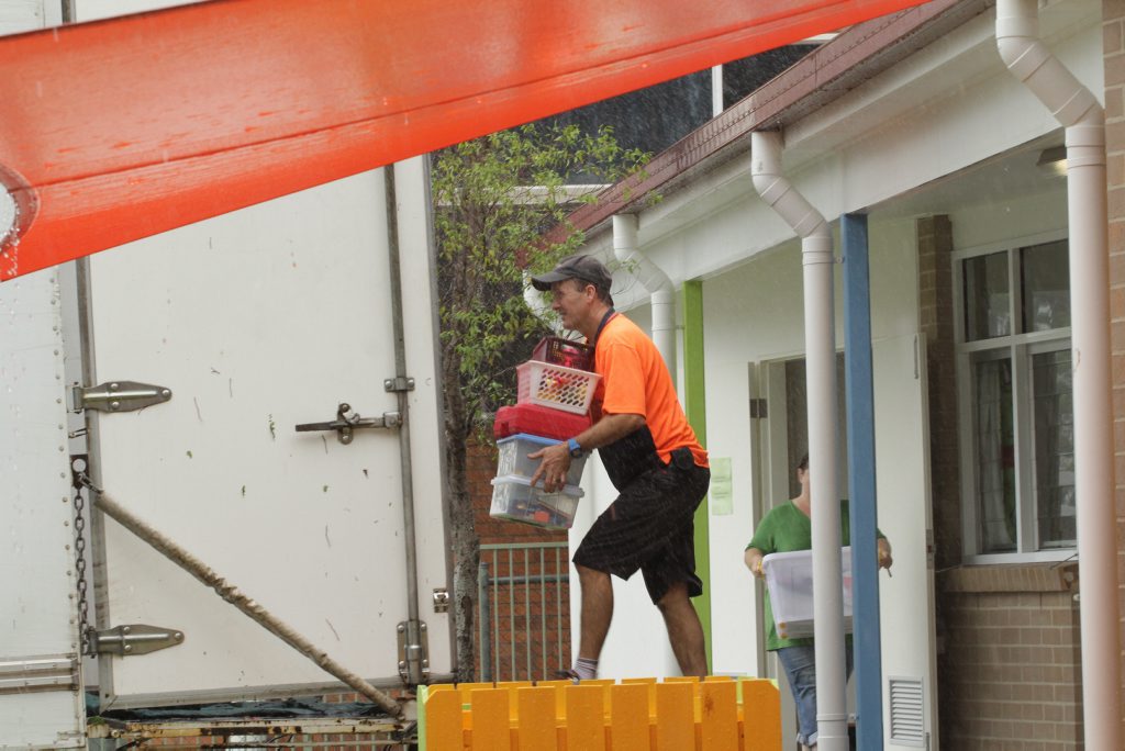 Removing stock from the Maryborough Toy library as water approaches. Photo: Robyne Cuerel / Fraser Coast Chronicle. Picture: Robyne Cuerel