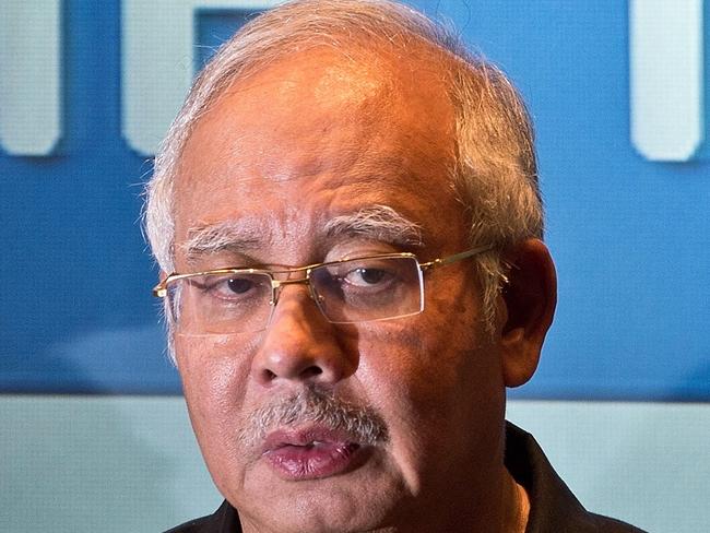 Malaysia's Prime Minister Najib Razak addresses a press conference at a hotel in Sepang, ouside Kuala Lumpur, on July 18, 2014, after Malaysia Airlines flight MH17 carrying 298 people from Amsterdam to Kuala Lumpur crashed in eastern Ukraine. A Malaysian airliner carrying 298 people from Amsterdam to Kuala Lumpur crashed on July 17 in rebel-held east Ukraine, as Kiev said the jet was shot down in a "terrorist" attack. Ukraine's government and pro-Russian insurgents traded blame for the disaster, with comments attributed to a rebel commander suggesting his men may have downed Malaysia Airlines flight MH17 by mistake, believing it was a Ukrainian army transport plane. AFP PHOTO / MANAN VATSYAYANA