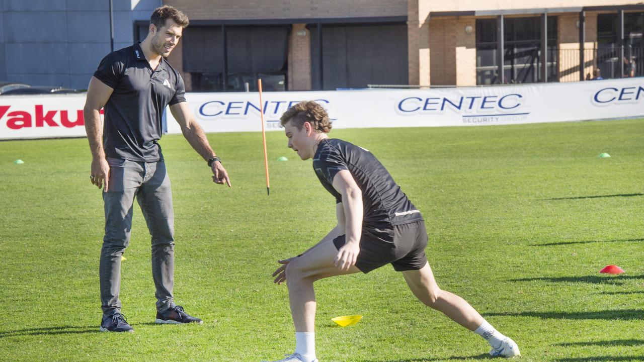 AFL star Alex Rance with academy student Cody Raak.