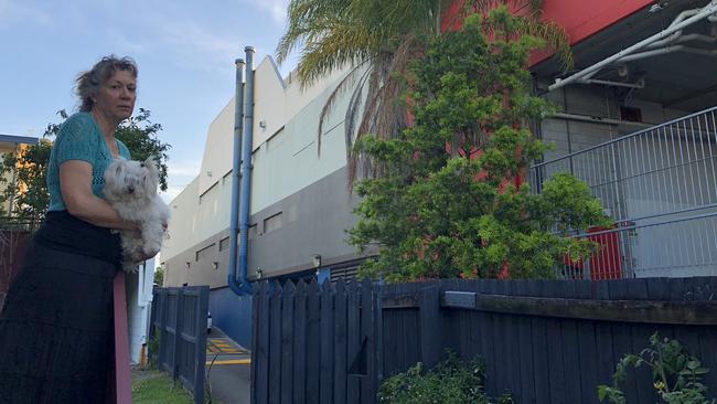 Lutwyche resident Shelley Threlfall, 64, at her East St apartment block. She says she now has no choice but to sell the block of units, after having issues with the pathway at the side of the block being used as a through-road. The noise is unbearable, and it's dangerous, she says.