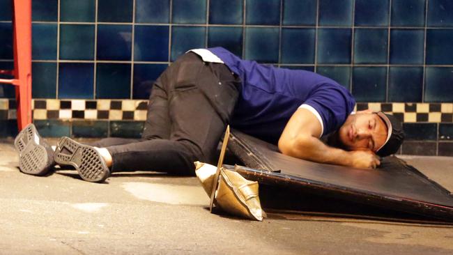 Pictured is a Bulldogs player laying on the ground after falling asleep during the Bulldogs Mad Monday Celebrations at the Harbour View Hotel at The Rocks.Picture: Christian Gilles