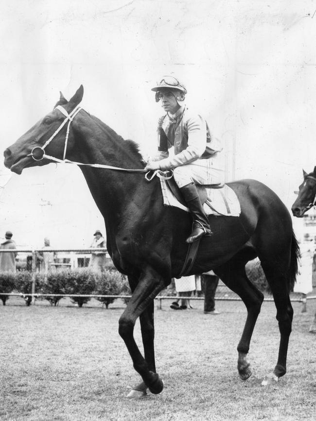 John Stocker returns to scale aboard Yangtze after winning the Port Adelaide Guineas in 1964.