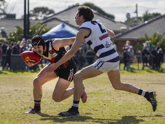 Devon Meadows captain Joel Hillis is tackled by Connor Benwell.