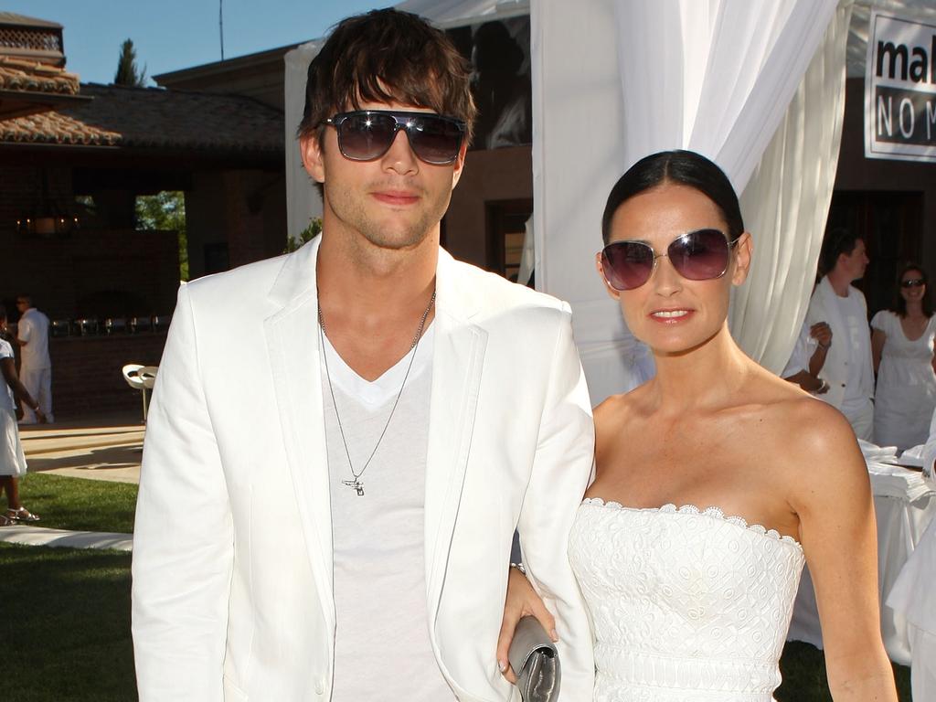 Ashton Kutcher and ex-wife Demi Moore at a White Party in 2009. There is no suggestion they knew anything about the criminal allegations. Picture: Supplied.