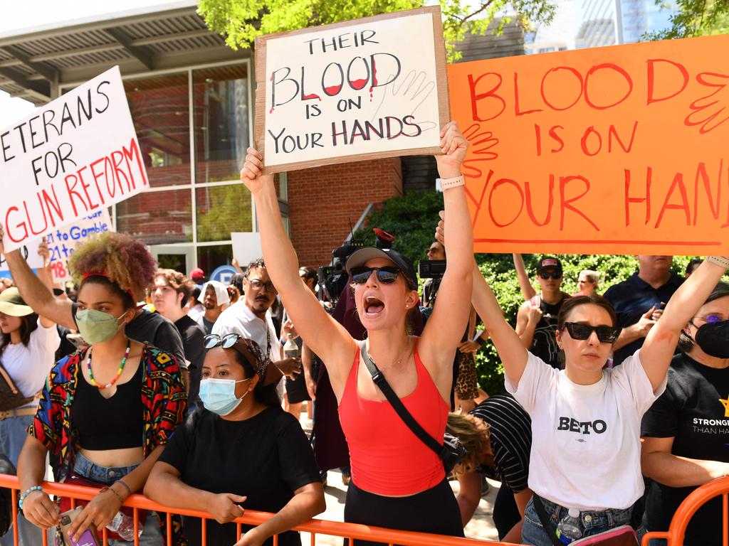 Protesters in support of gun control hold signs outside the National Rifle Association Annual Meeting. Picture: Patrick T.Fallon/AFP