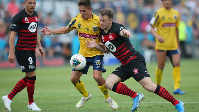 Wanderer Simon Cox, right, takes on Joshua Nisbet in the clash with the Mariners